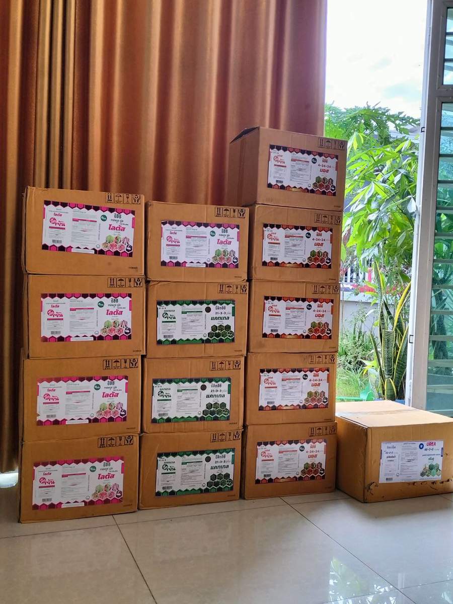 Stacked cardboard boxes of Lada brand agricultural products