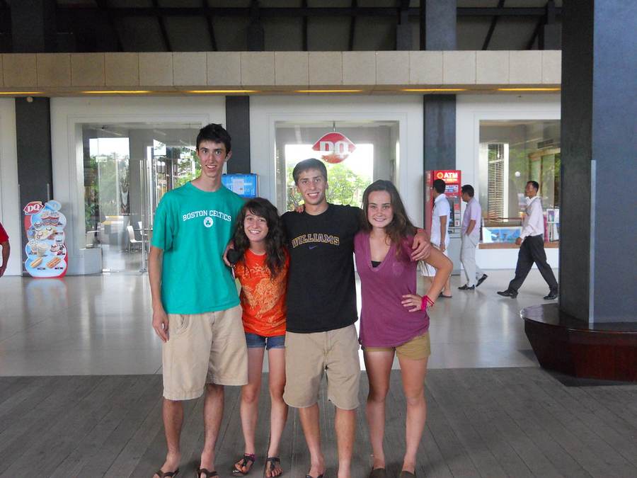 Four volunteers posing together in front of Dairy Queen restaurant